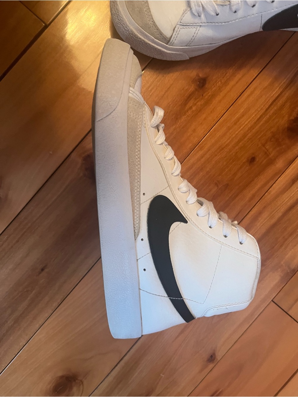 Nike White High-Top Sneakers with Black Swoosh